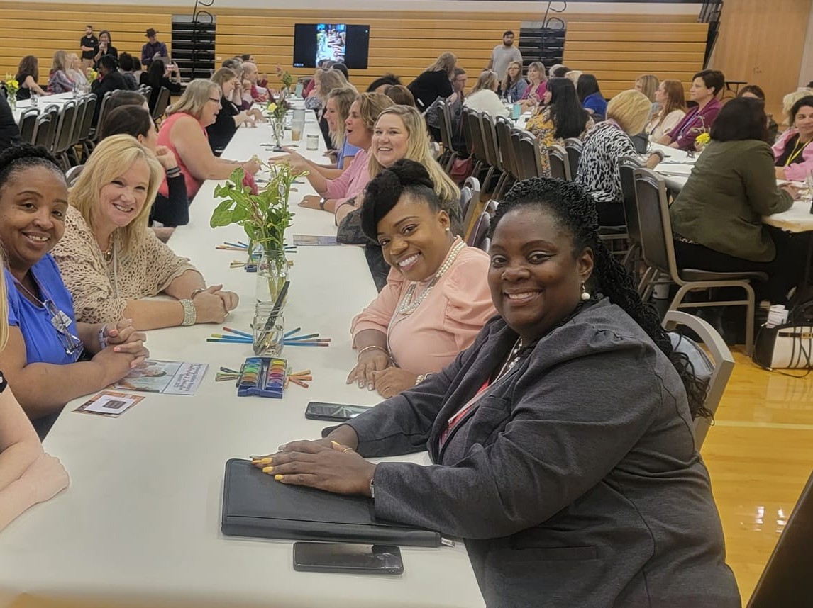 Women gathering, sharing ideas and building connections at a regional summit